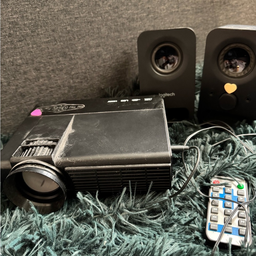 Black Projector with Logitech Speakers and Remote